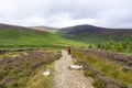 Lanscape of Wicklow way in a cloudy day with an excursionist girl