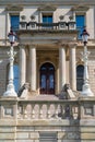 Lansing MI - May 6, 2023: South entrance to the Michigan Capitol building with ornate marble, steps and lamppost