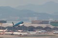 Vietnam Airlines airplane is running for take off at runway, all parking space is fully