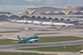 Vietnam Airlines airplane is running for take off at runway, all parking space is fully