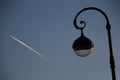 A lantern and an airplane flying into the distance Royalty Free Stock Photo
