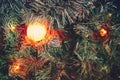 Lantern on the background of branches of a Christmas tree covered with snow, background. Yellow lamp in fir branches in the snow, Royalty Free Stock Photo