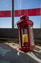 Lantern with a candle against the sky in the old lighthouse