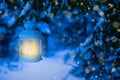 Lantern for Christmas in the woods under the tree. Lantern with a candle on Christmas eve Royalty Free Stock Photo