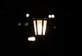 Lantern in the dark. Burning lantern in the dark. Electric lamp.