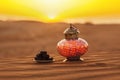 Lantern and dates in the desert at a beautiful sunset