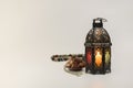 Lantern with Dates fruits and rosary beads.