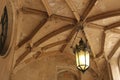 Lantern Hanging from a Stone Ceiling