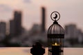 Lantern that have moon symbol on top and dates fruit for Ramadan Kareem