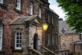 Lantern lit at dusk in the buildings of the medieval castle of Edinburgh, Scotland, UK. Royalty Free Stock Photo