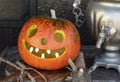 The lantern is made from pumpkin for Halloween. Scary traditional pumpkin mask. Royalty Free Stock Photo