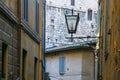 lantern between medieval houses on street in Siena Royalty Free Stock Photo