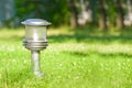 Lantern in the middle of a lawn Royalty Free Stock Photo