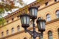 Lantern near main building of the Saeima - parliament of the Republic of Latvia in Riga Old City