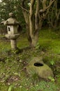 Lantern and rock pond in japaneese garden Sankei-en Royalty Free Stock Photo