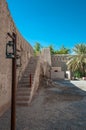 Lantern and ruins of the wall of Nizwa Fort, Oman