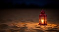 Lantern on the sand at night. Ramadan Kareem concept