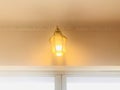 Lantern sconce. Wall lamp above floor-to-ceiling glass door. Royalty Free Stock Photo