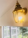 Lantern sconce. Wall lamp on the glass door. Royalty Free Stock Photo