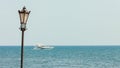 Lantern on sea ocean background with ship.