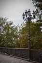 A lantern stands in an empty autumn park