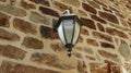 Lantern on the stone wall Royalty Free Stock Photo