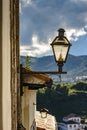 Lantern stuck to the facade of an old colonial-style house Royalty Free Stock Photo