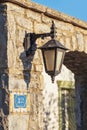 Lantern vintage on the wall of an old stone Royalty Free Stock Photo