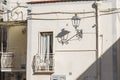 Lantern on the wall of an old house in the old town of Tavira, Portugal Royalty Free Stock Photo