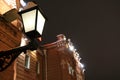 Lantern on wall of railway station building at night Royalty Free Stock Photo