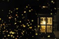 Burning lantern at christmas time in a cold winter night with golden bokeh. Royalty Free Stock Photo