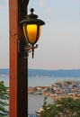 Lantern on a wooden pole in an outdoor cafe.