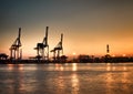 Genova Porto Antico harbor view with cranes and Lanterna landmark Royalty Free Stock Photo