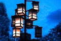 Dark evening cityscape. Lanterns.