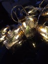 Lanterns in the form of jars. Flasks with snow and Christmas trees inside. Unusual glowing lights.