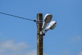 Lanterns on the pole. A pillar of power line with lighting fixtures Royalty Free Stock Photo