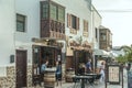 seaside promenade with tavernas and shops in lanzarote, spain