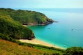 Lantic Bay Cornwall England secluded beach with blue turquoise sea and yachts