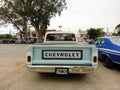 old 1970s Chevrolet Chevy C10 pickup truck. Rear view. Logo and branding. AAA 2022 classic car show