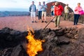 LANZAROTE, SPAIN - DEC 13 2018: Tourists watching artificial volcanic fire in Timanfaya National Park, Lanzarote, Canary Islands, Royalty Free Stock Photo