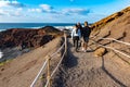 LANZAROTE, SPAIN - DEC 16, 2018: Unidentified people walking in El Golfo and Green Lagoon. The Gulf is a lagoon in a volcanic