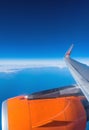 EasyJet airplane`s wing and aerial view of Atlantic Ocean Royalty Free Stock Photo
