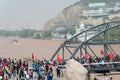 LANZHOU, CHINA - OCT 2 2014: Visitor at Sun Yat-Sen Bridge (Zhongshan Qiao). a famous First Bridge across the Yellow River in Lan