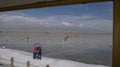 Tourists & monks visiting the China Caka salt lake