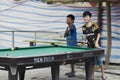 Lao Cai, Sapa, Vietnam - 08 18 2014: Two asian teenagers playing billiards with soccer Chelsea shirt jersey in Lao Cai, Vietnam