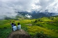 Lao Cai, Vietnam - Sep 7, 2017: Terraced rice field on harvesting season with children sitting on rock in Y Ty, Bat Xat district