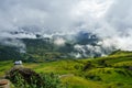 Lao Cai, Vietnam - Sep 7, 2017: Terraced rice field on harvesting season with children sitting on rock in Y Ty, Bat Xat district