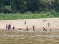 Lao kids playing in the Mekong River. Luang Phabang, Laos, Asia