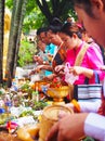 People making merit, Buddhist, Laos