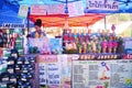 Lao woman people sale soft drinks water juice and food snack for laotian people and foreign travelers travel visit in local shop